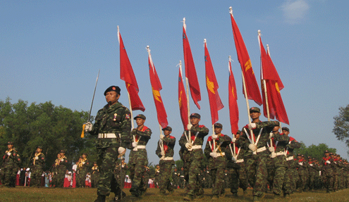 The captain’s Nai Bot is leading at marching with Mon National Liberation Armies during the 63 Mon National Day ceremonies in Palanjapan village, near to Three Pagodas Pass. ( Photo: IMNA )